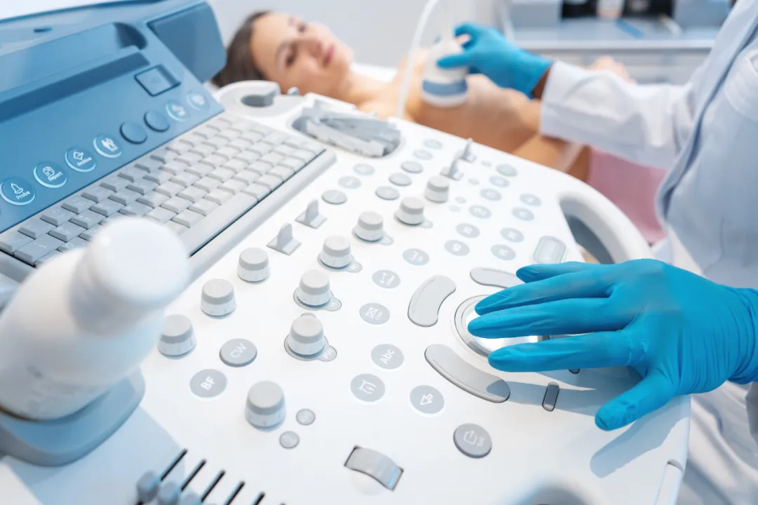 Ultrasound examination being performed on a patient