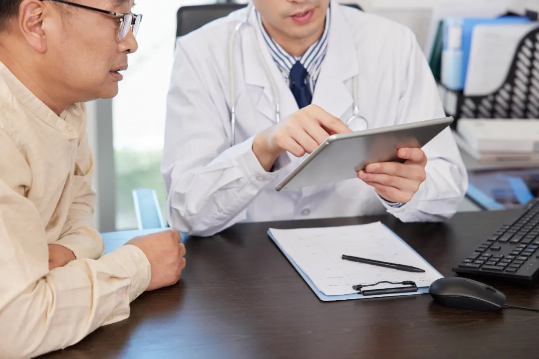 Physician consulting with patient during a multidisciplinary team discussion