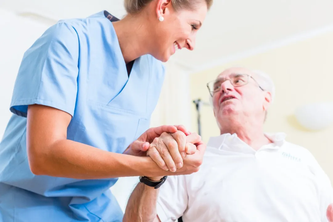 Nurse providing supportive care to elderly patient